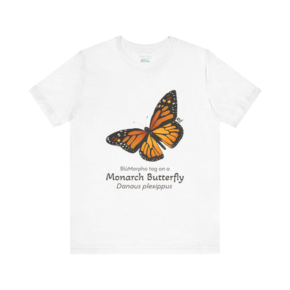 White t-shirt with a monarch butterfly illustration and text on a white background