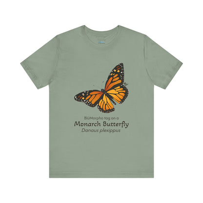 sage Green t-shirt with a monarch butterfly illustration and text on a white background