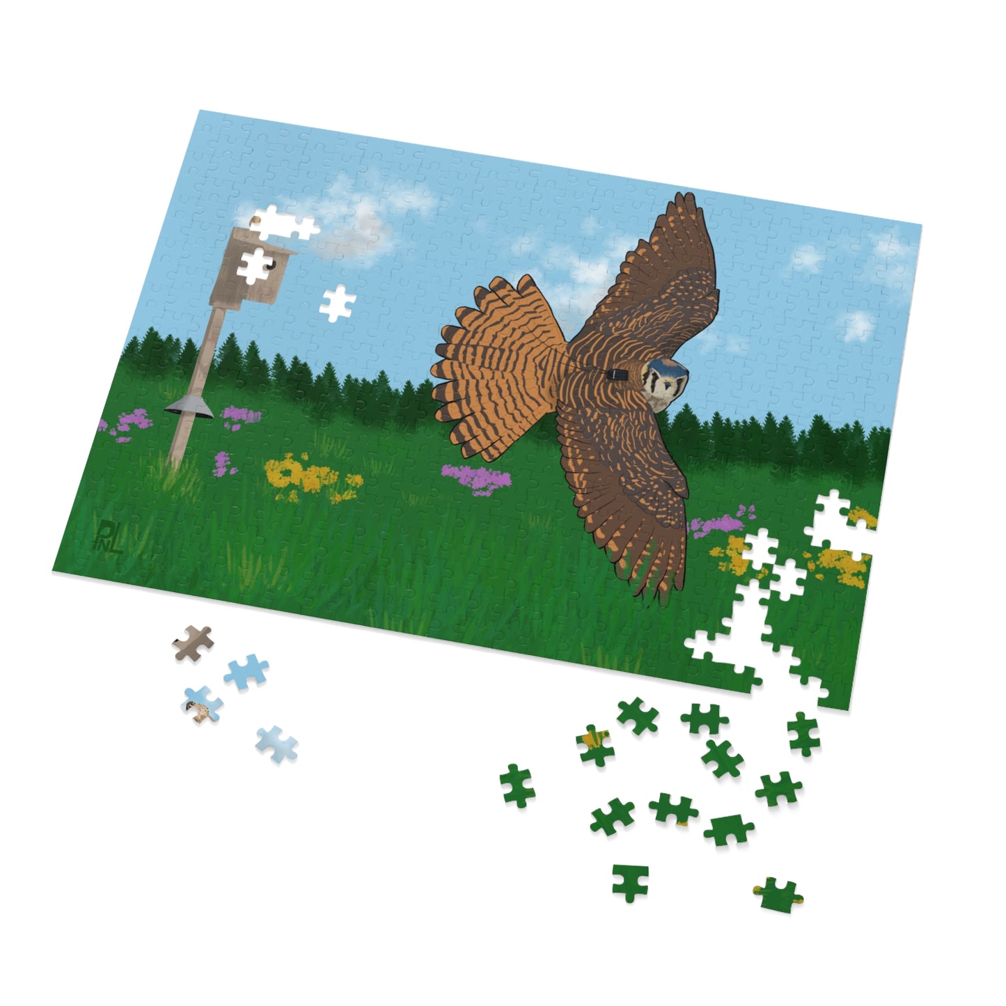 Jigsaw puzzle with an American Kestrel flying over a field with flowers and a nest box with a blue sky and forest on white background