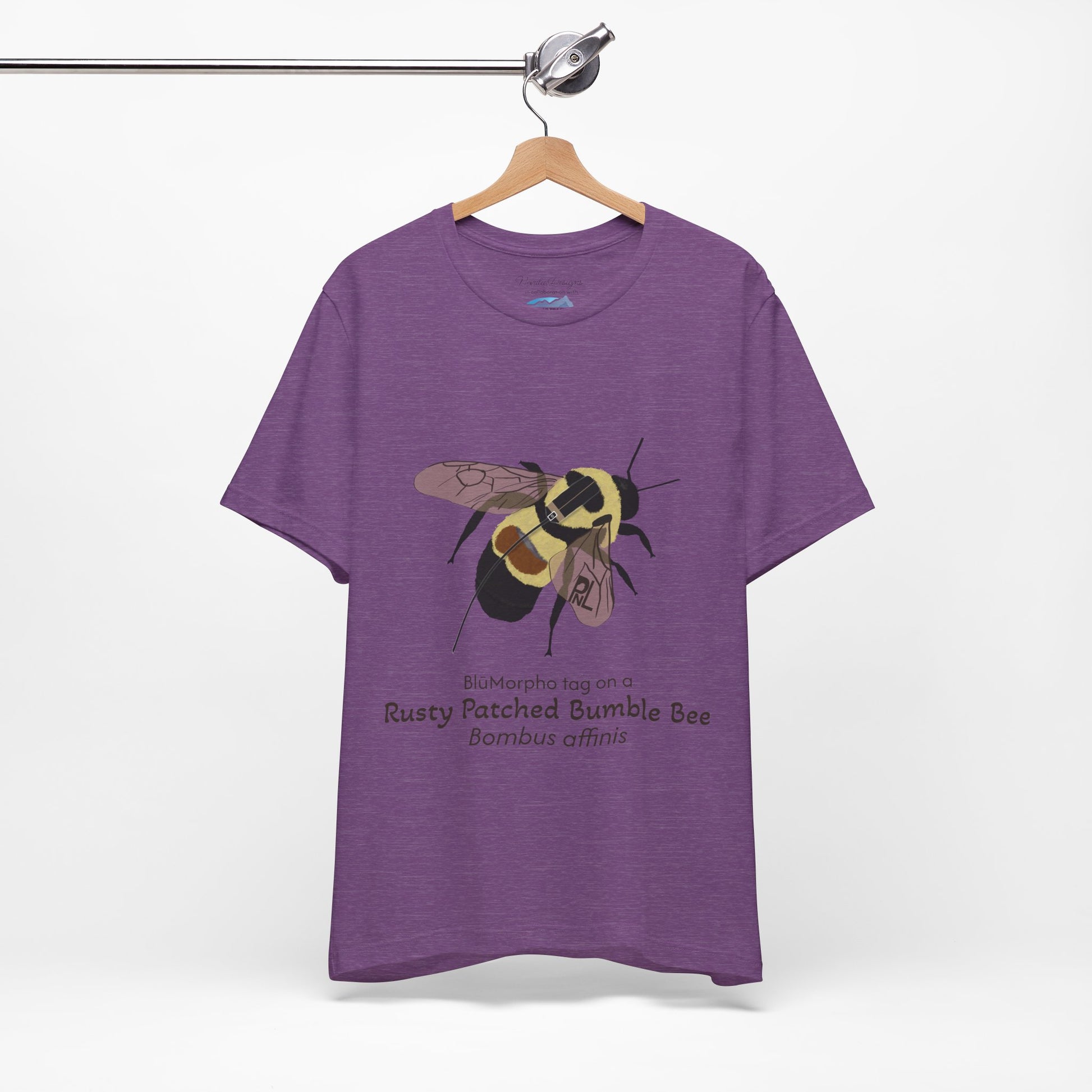 Purple t-shirt with a rusty patched bumble bee illustration and text on a hanger against a white background