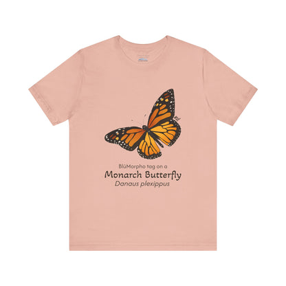light orange t-shirt with a monarch butterfly illustration and text on a white background