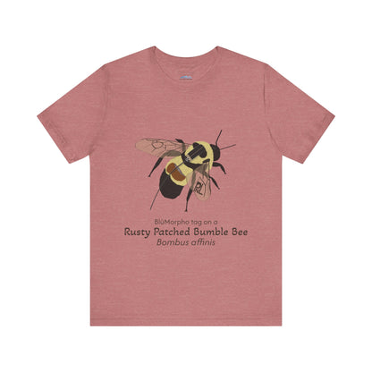 mauve t-shirt with a rusty patched bumble bee illustration and text on a white background