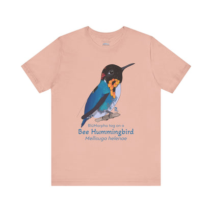 light orange t-shirt with a colorful bee hummingbird illustration and text on a white background