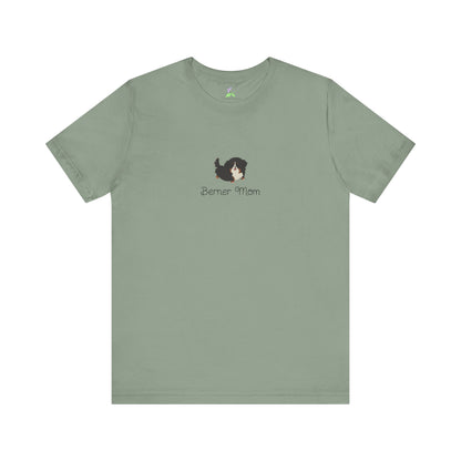 Sage green t-shirt with a kawaii dog illustration and 'Berner Mom' text on a white background