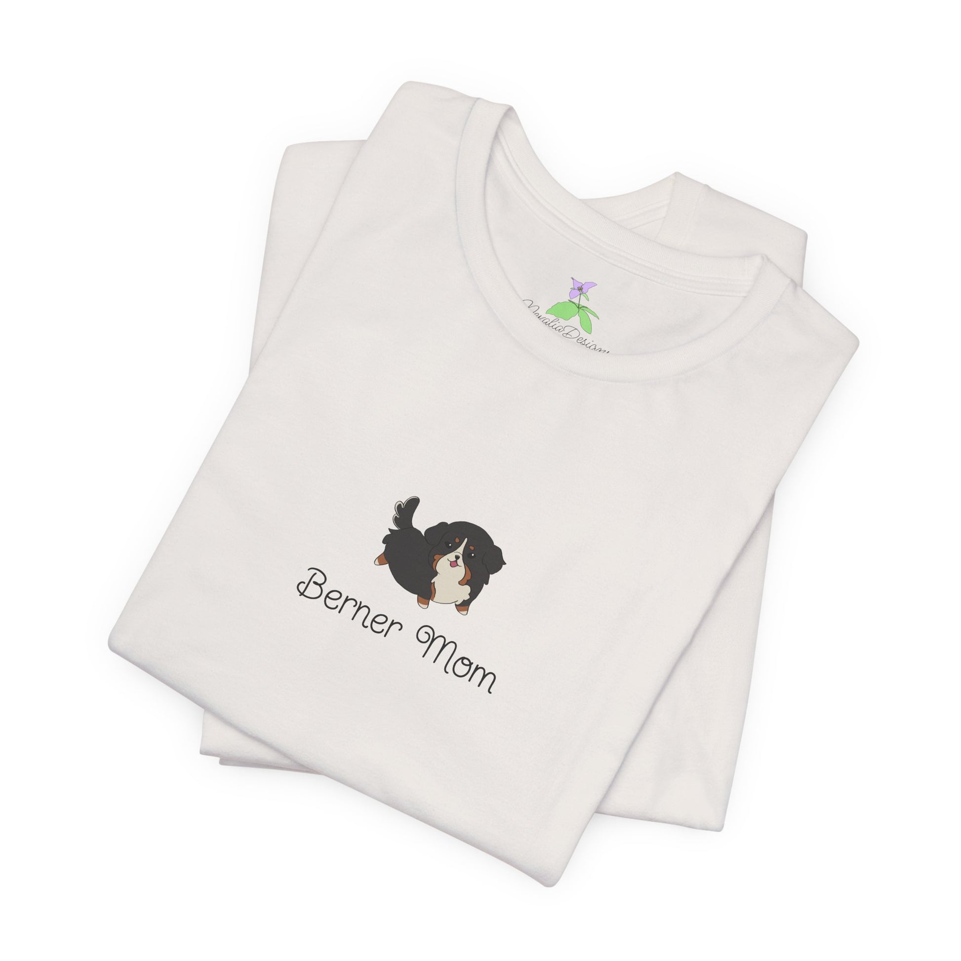 Folded white t-shirt with a kawaii dog illustration and 'Berner Mom' text on a white background