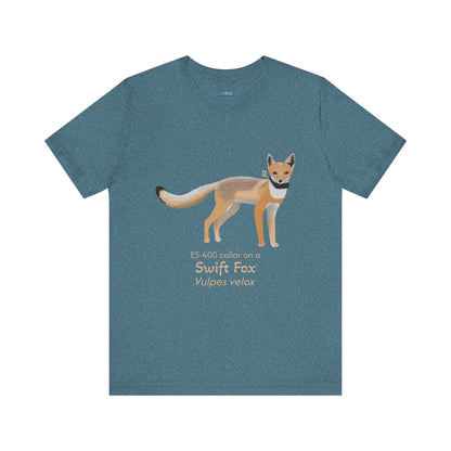 Blue green t-shirt with a swift fox illustration and text on a white background